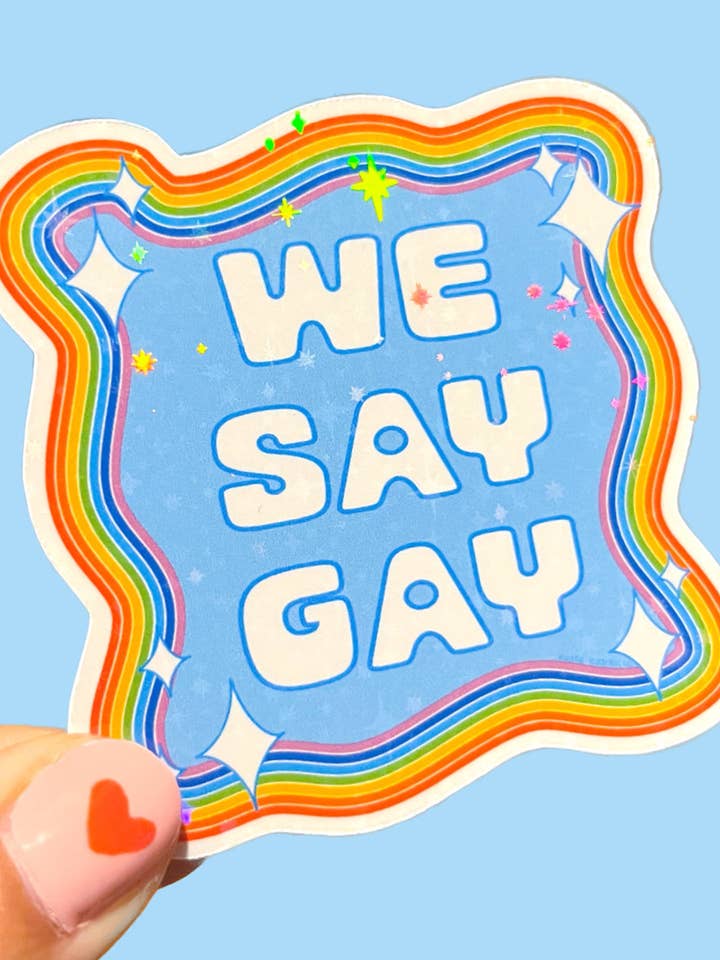 We Say Gay Sparkle Sticker for wholesale by Katie Carrillo