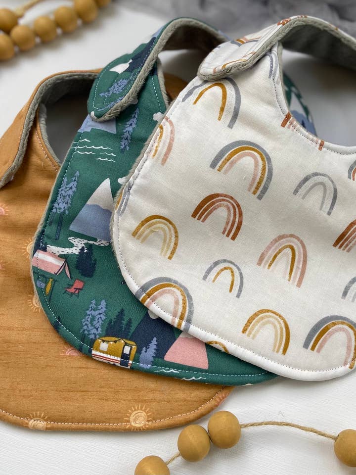 Muted Rainbows bib for wholesale by Port & Starbird