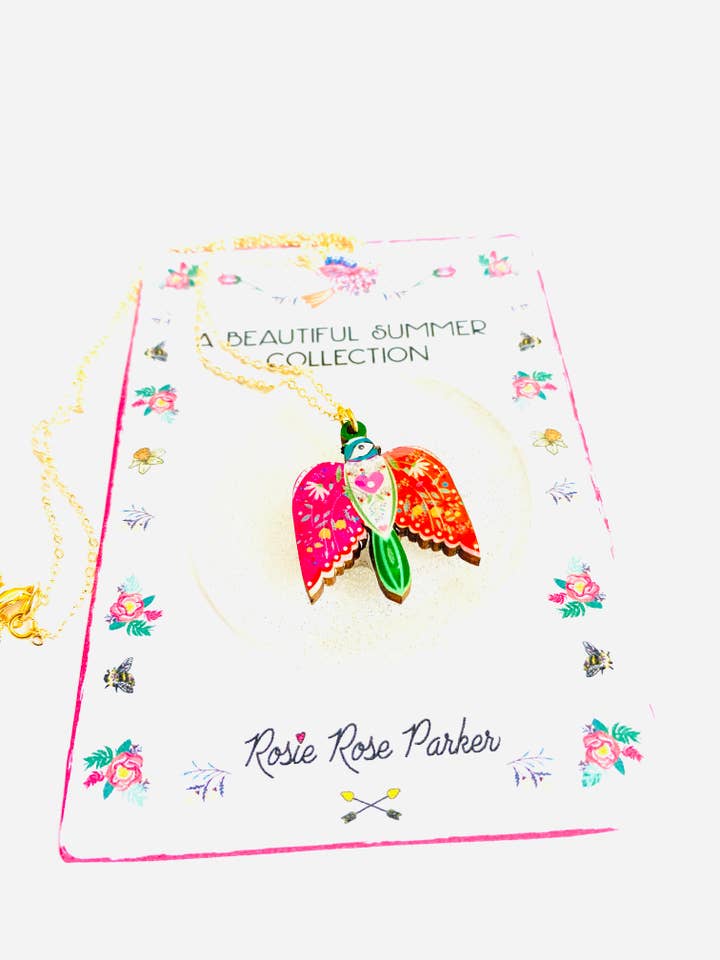 Pretty bird in flight necklace on gold chain, pendant for wholesale by Rosie Rose Parker