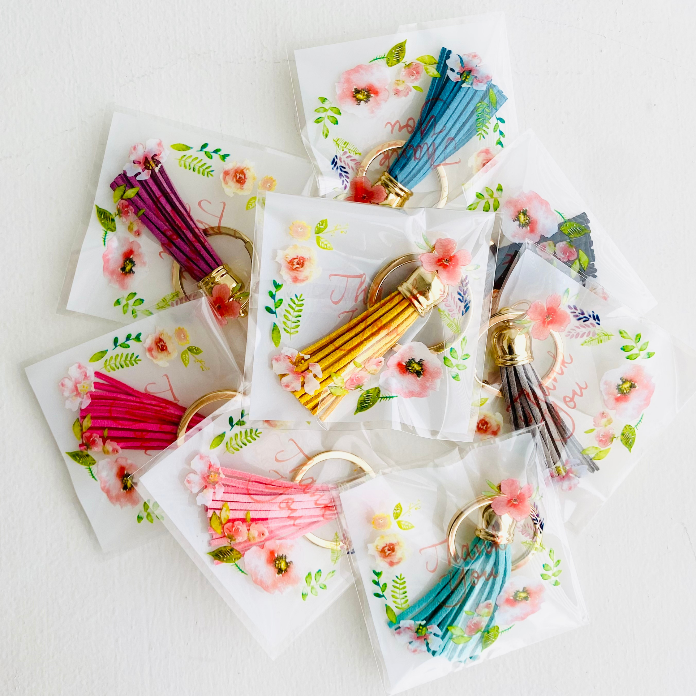 Assortito Regali di Ringraziamento - Mini Portachiavi con Nappa in vendita all'ingrosso su Faire2