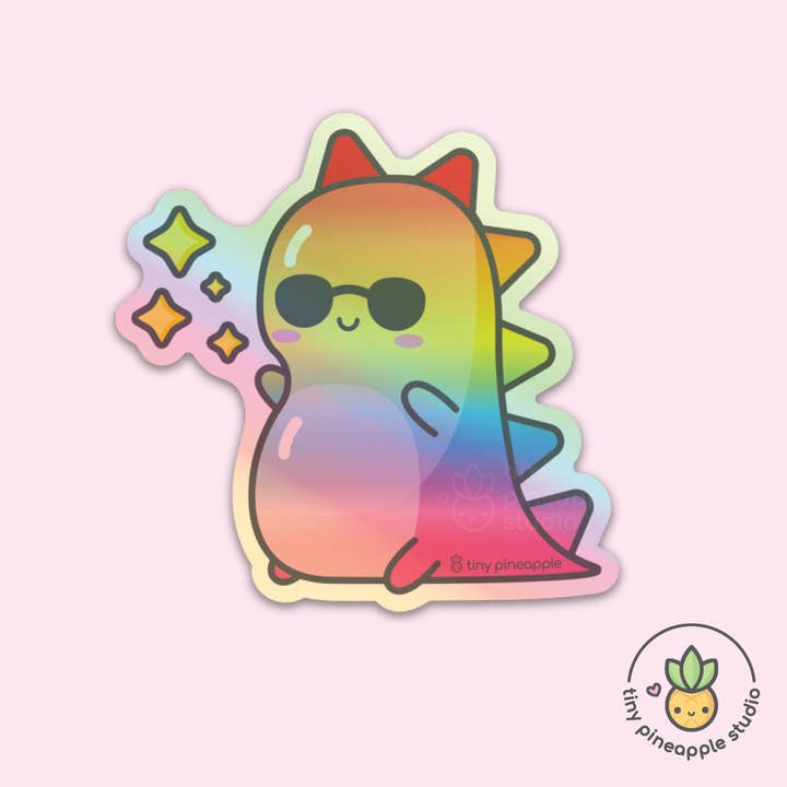 Rainbow shiny dino HOLOGRAPHIC VINYL STICKER for wholesale by Tiny Pineapple Studio