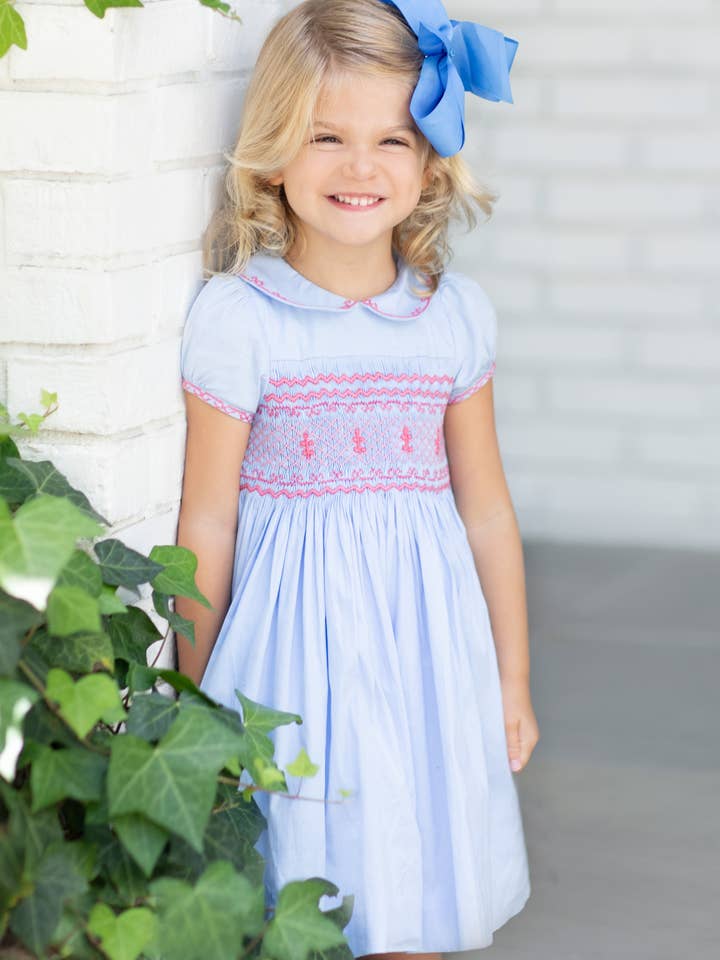Princess Charlotte Heirloom Blue Smocked Dress for wholesale by Antoinette Paris