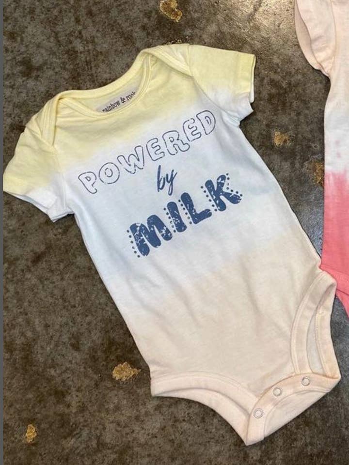 Powered by Milk Dip Dye Onesie for wholesale by Rainbow and Rocket