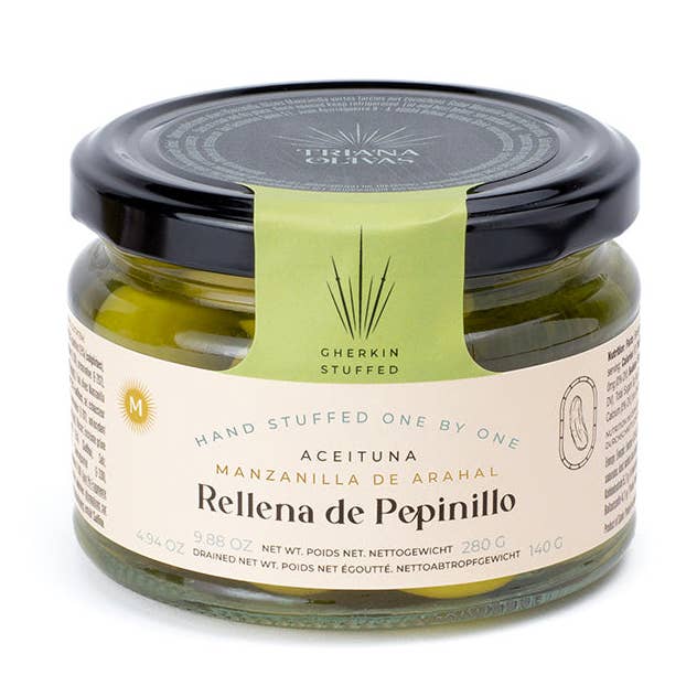 Triana Olivas. Manzanilla Olives stuffed with Gherkins for wholesale by meDINEterranean