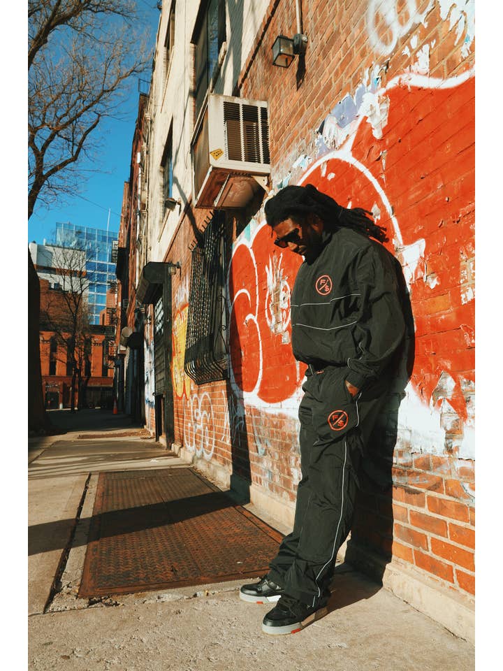 Black Red MOTION Nylon Pants (BRED) for wholesale on Faire5