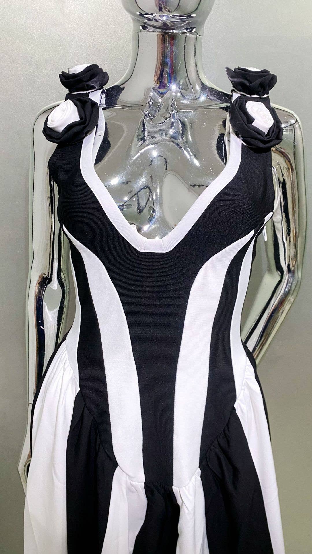 DR411 Deep V Black & White Striped Dress with Floral Accents for wholesale on Faire6