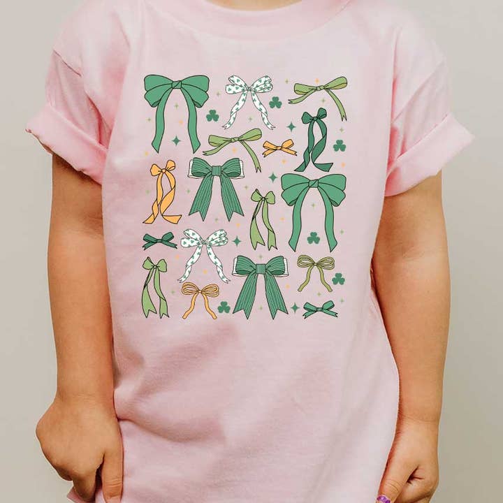 Green St Patty's Day Coquette Bows Shamrock Kids Graphic Tee for wholesale by Kids By Kissed Apparel
