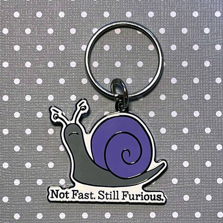 Sleutelhanger met slak voor wholesale door Snarky Pants Studios