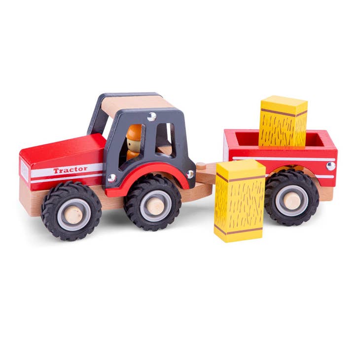 Tracteur en bois avec remorque et balles de foin pour la vente par New Classic Toys EU