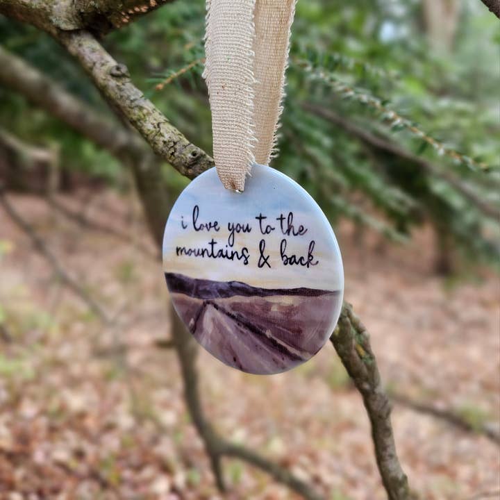 I Love You To The Mountains & Back Ceramic Ornament for wholesale by The Cranberry Finch
