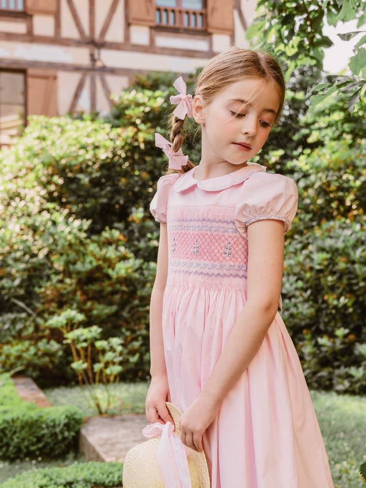 Princess Charlotte Heirloom Pink Smocked Dress for wholesale by Antoinette Paris