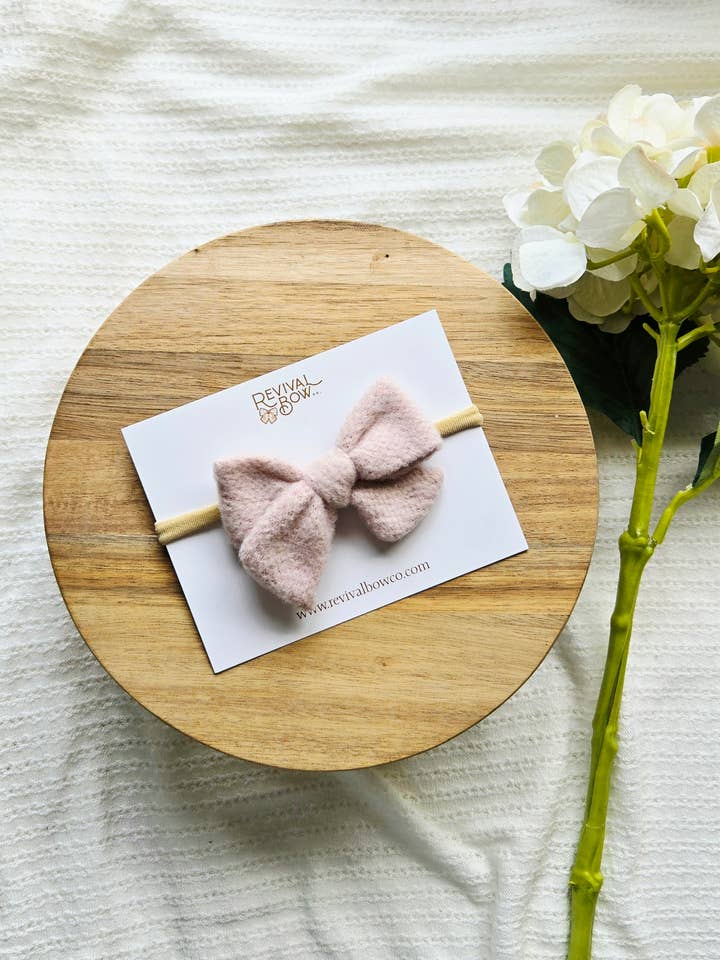 Small Pinwheel Bow on Headband • Soft Pink Beige for wholesale by Revival Bow Co.