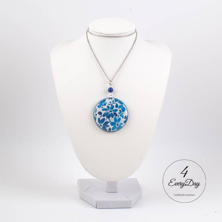 Handcrafted medallion in wood and resin with blue flowers for wholesale by 4everyday Handmade