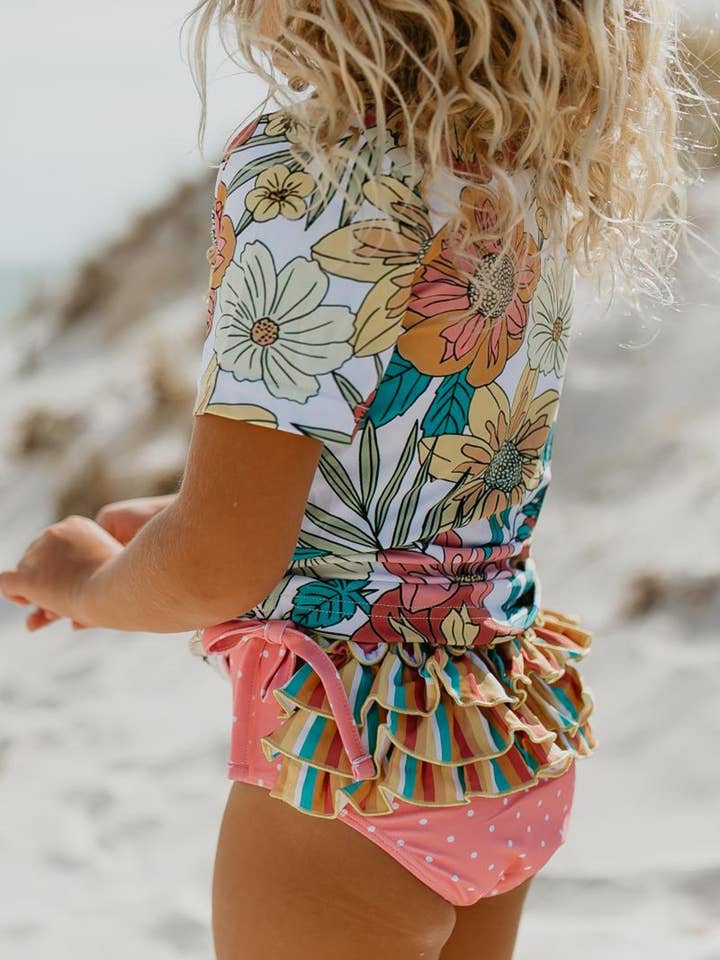 Kids Pink Tropical Rash Guard Ruffle Swimsuit and other Purchase Wholesale bathing suit. Free Returns & Net 60 Terms on Faire trending on Faire.