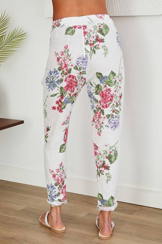 Wit LINNEN BROEK MET BLOEMENPRINT EN PAILLETTEN ZIJSTREEP (16-08-FLORAL) voor groothandel op Faire2