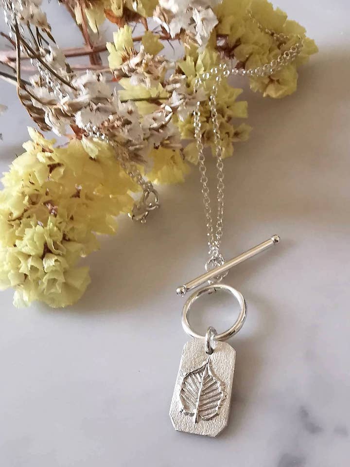 Celtic Tree Zodiac Tablet Necklace for wholesale by NIXEY