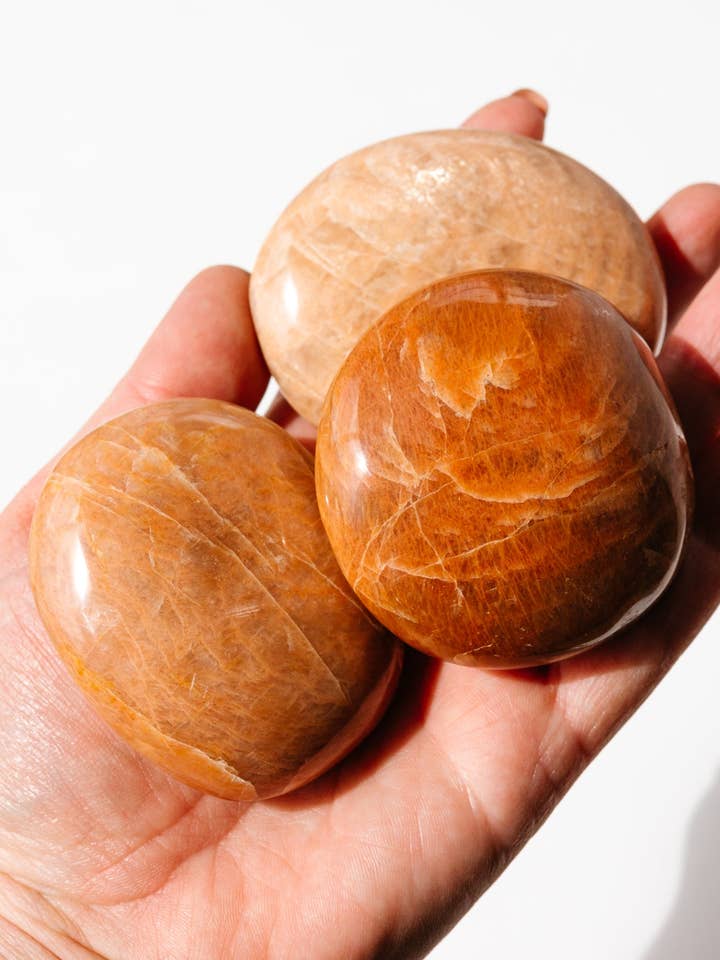 Peach Moonstone Palm Stone for wholesale by Apothecary Co.