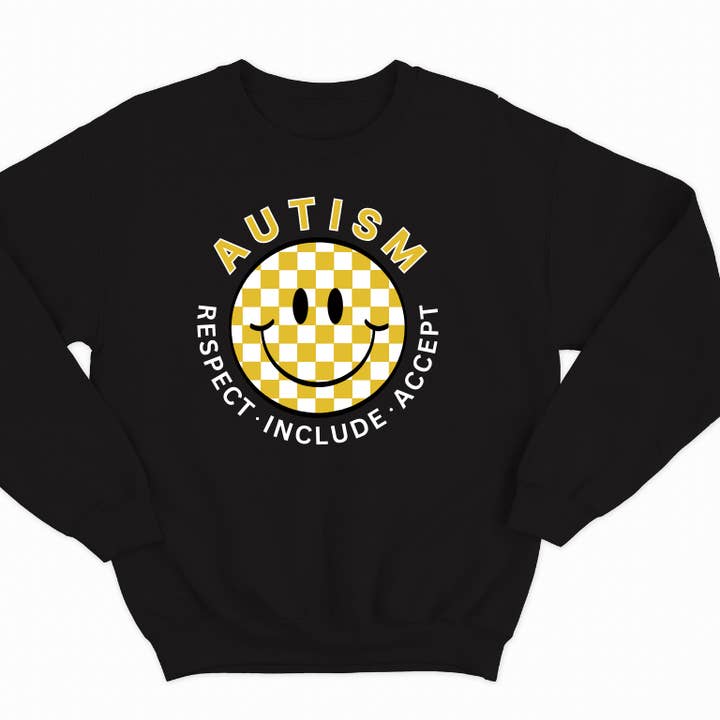 Felpa con scritta «Autism Acceptance» con faccina sorridente a quadretti per la vendita all'ingrosso da parte di A is for Avery