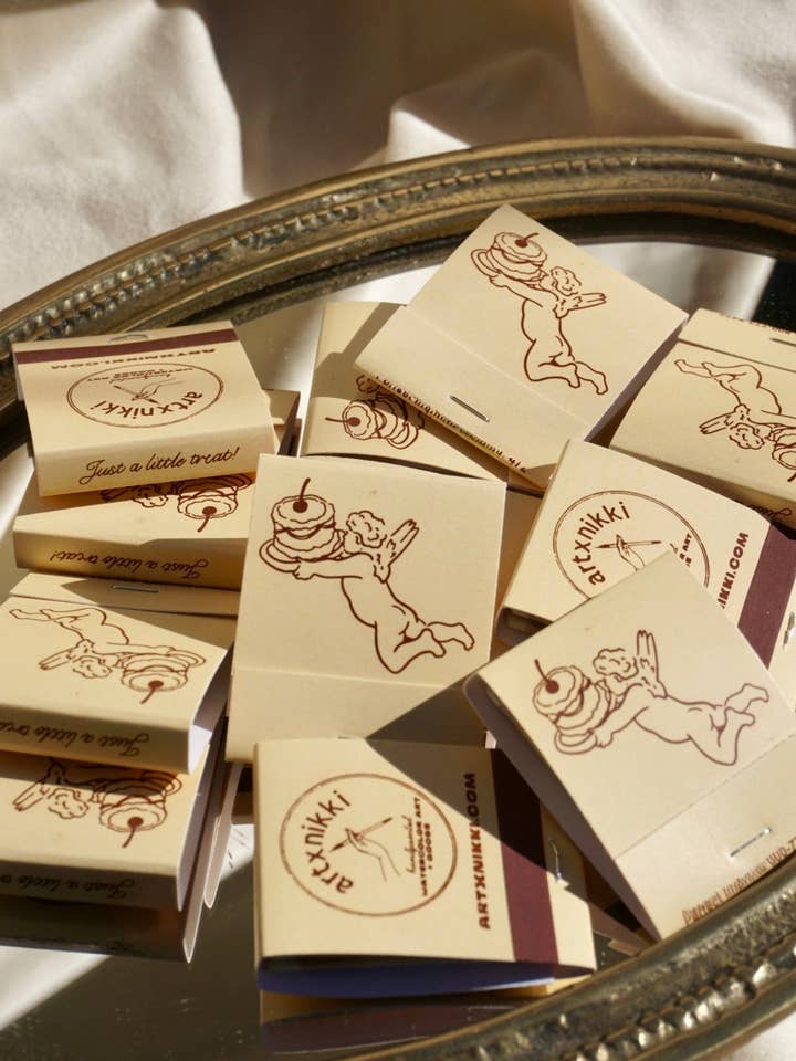 “Just A Little Treat!” Cupid Cake Matchbook for wholesale by artxnikki
