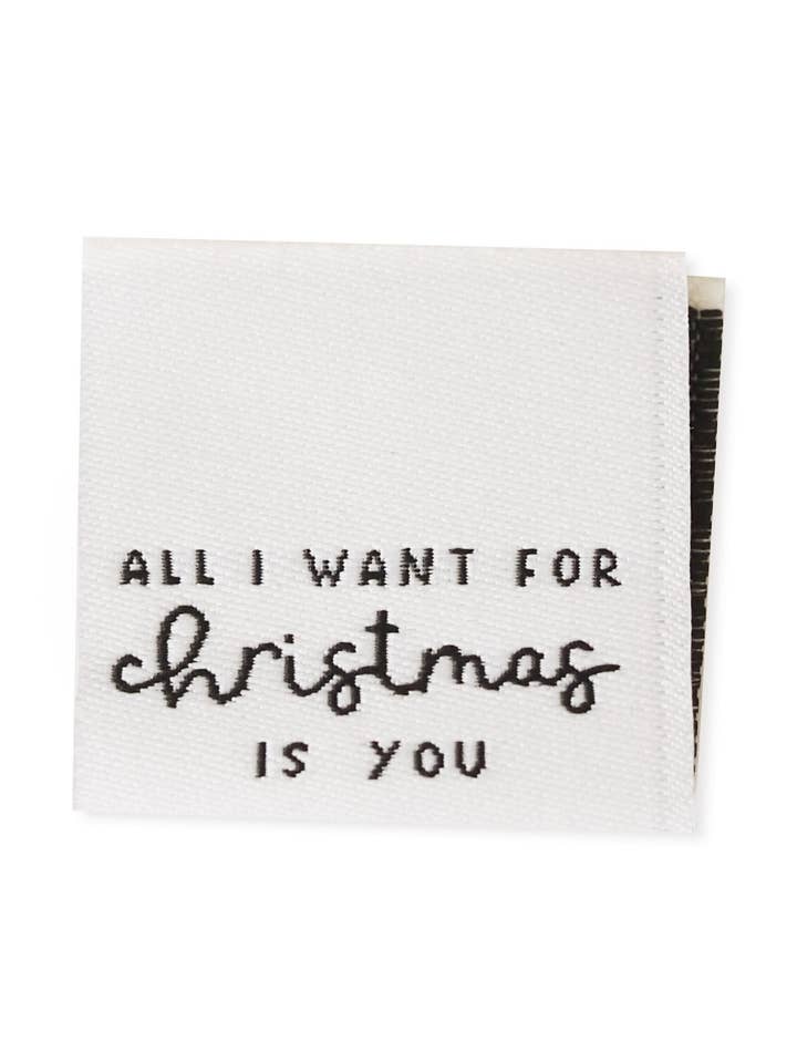 Klapp-webbetikett *all I want for christmas* för wholesale av Paul und Clara