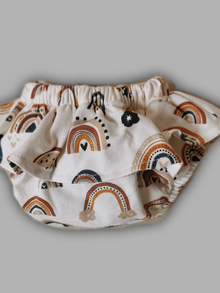 Couvre-couche jupe arc-en-ciel pour la vente par la petite hirondelle