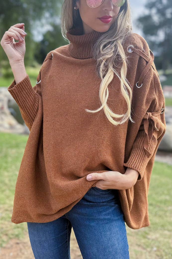 Cognac Poncho in maglia a collo alto con maniche stringate color cognac in vendita all'ingrosso su Faire5