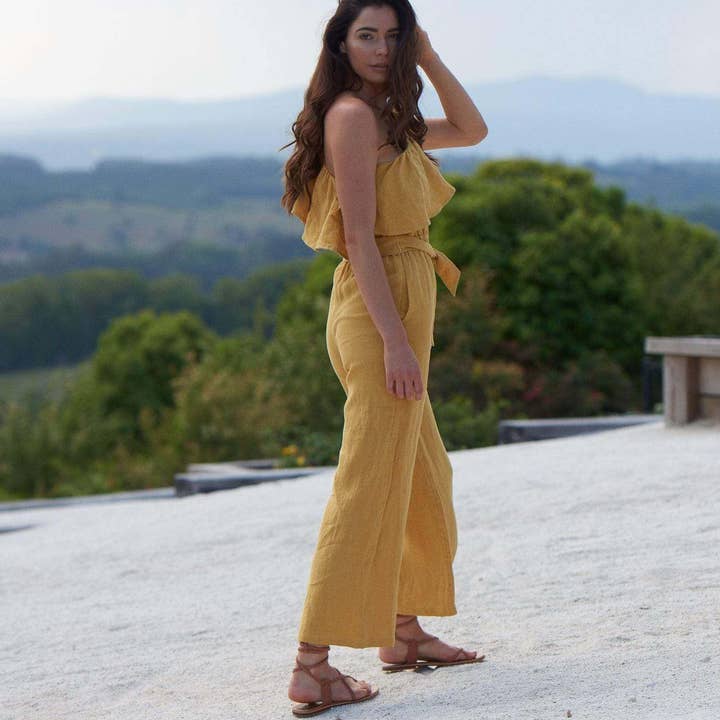 The Kalani Jumpsuit ~ Turmeric and other Purchase Wholesale jumini. Free Returns & Net 60 Terms on Faire trending on Faire.