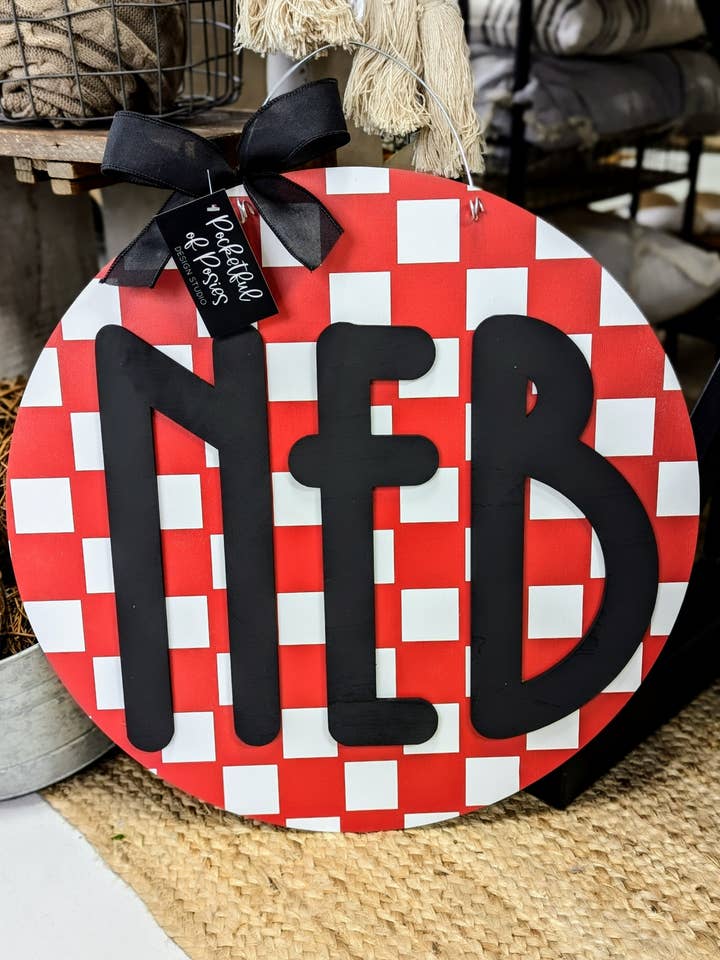 Checkered Nebraska Door Hanger for wholesale by Pocketful of Posies