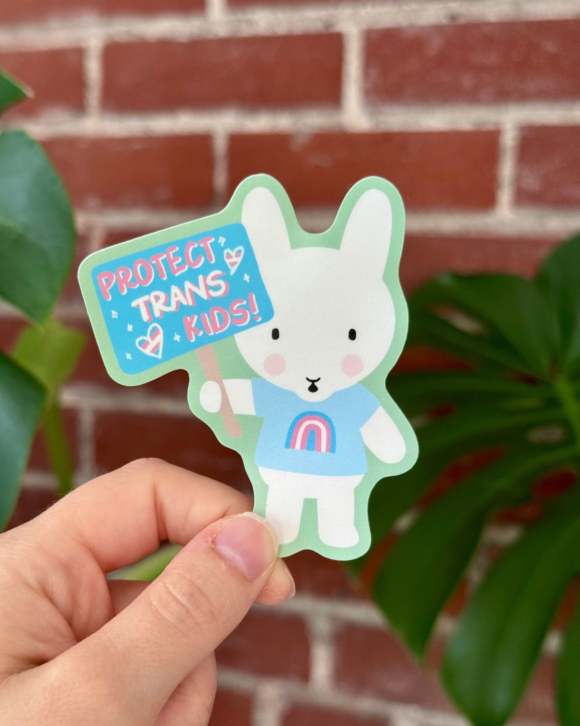 Clem & Co. - Wholesale Sticker - Clem the Bun says "Protect Trans Kids" Sticker0