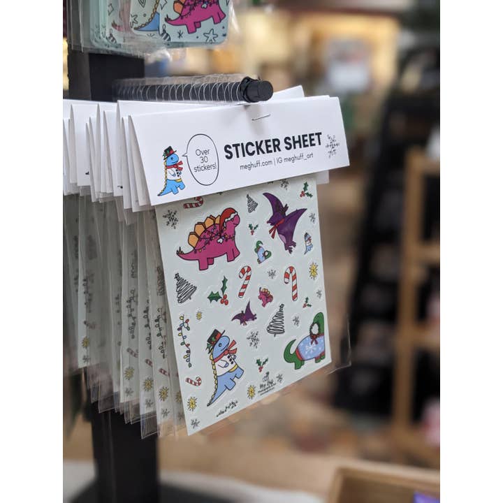 Winter Holiday Dinosaur Sticker Sheet for wholesale by Meg Huff Photography & Art