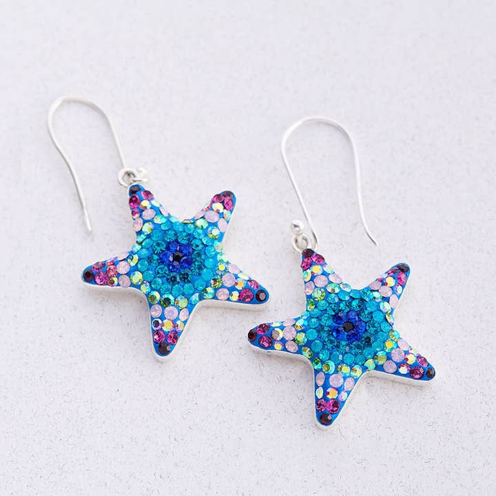 PE-8145/OORBELLEN MET FONKELENDE ZEESTERREN IN KRISTAL EN ZILVER voor wholesale door Mosaico Jewels