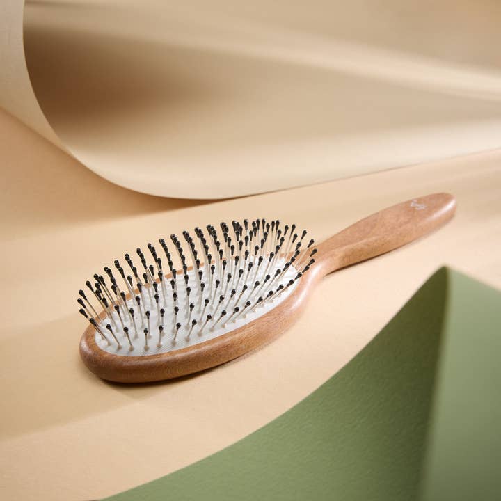 Detangling hairbrush oval with steel pins and knobs for wholesale by Fa brushes