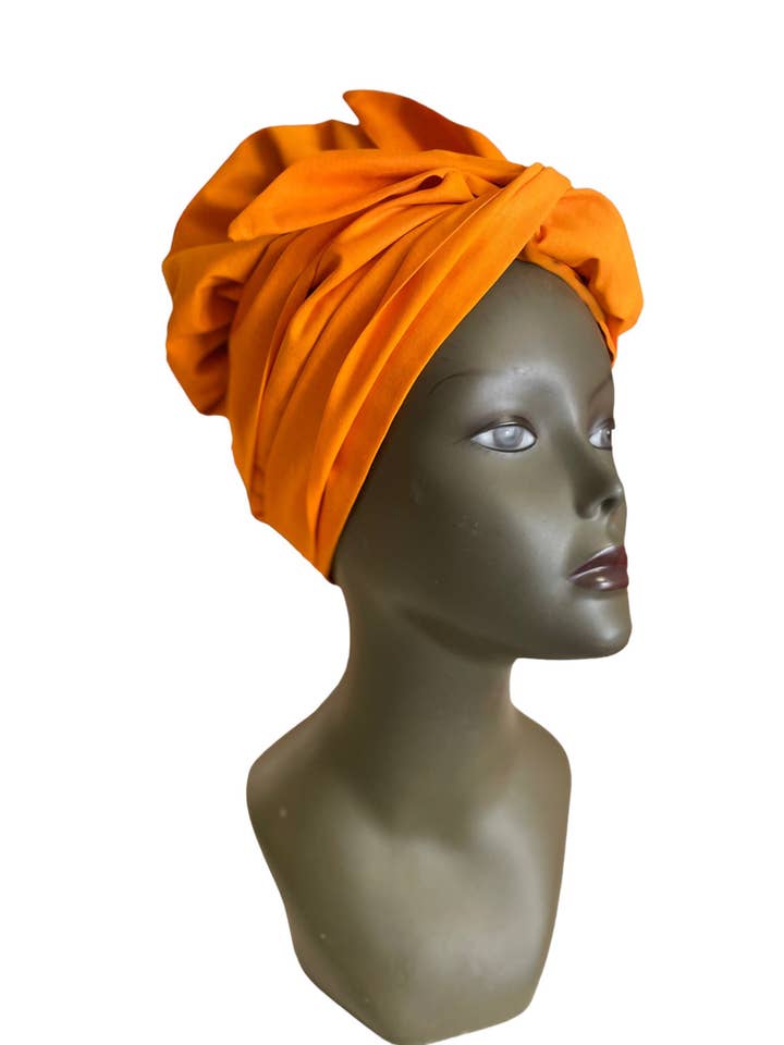 Met satijn gevoerde Hollandse waxtulband van Georges Décimus voor wholesale door Esancyel cosmetics