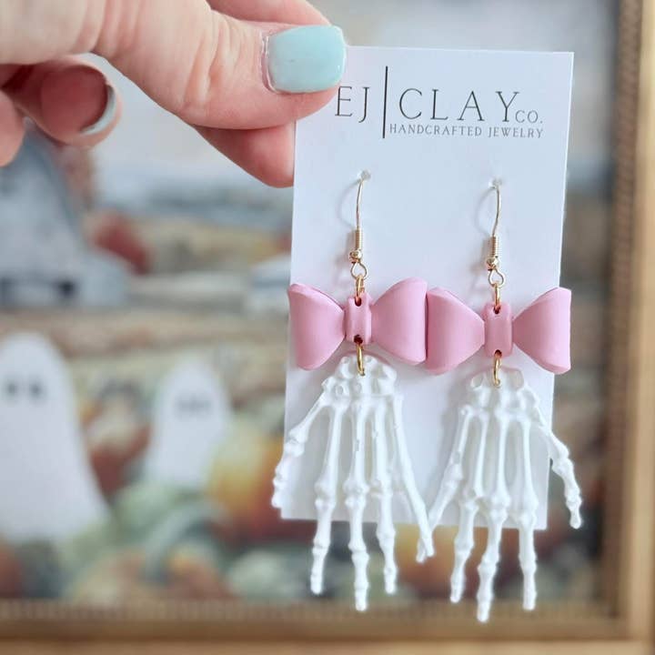 EJ Clay Co - Wholesale Dangle Earrings - Pink Bow Skeleton Hand Dangles