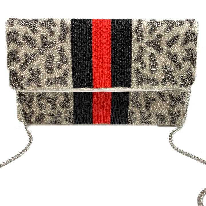 ZILVERGRIJZE CLUTCH MET LUIPAARDKRALEN EN RODE EN ZWARTE STREPEN voor wholesale door Pizzazz, Inc.