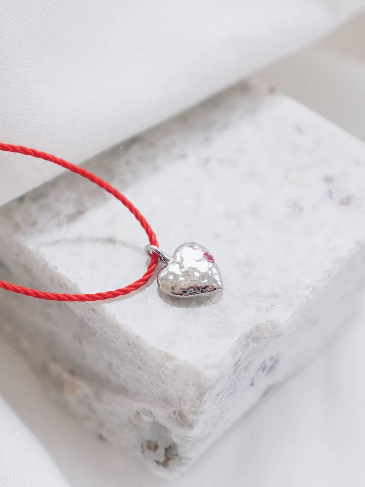 Red String Silver Heart With Garnet Necklace for wholesale by Lyon and Feather