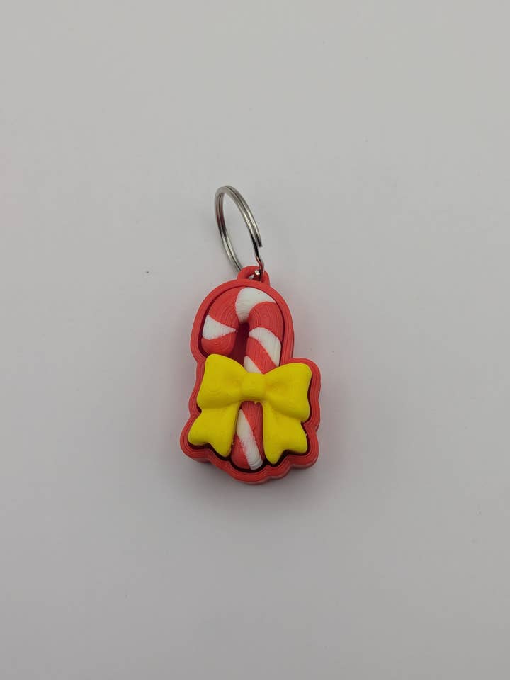 3D Printed Candy Cane Fidget Clicker Keychain for wholesale by The Midnight Oil