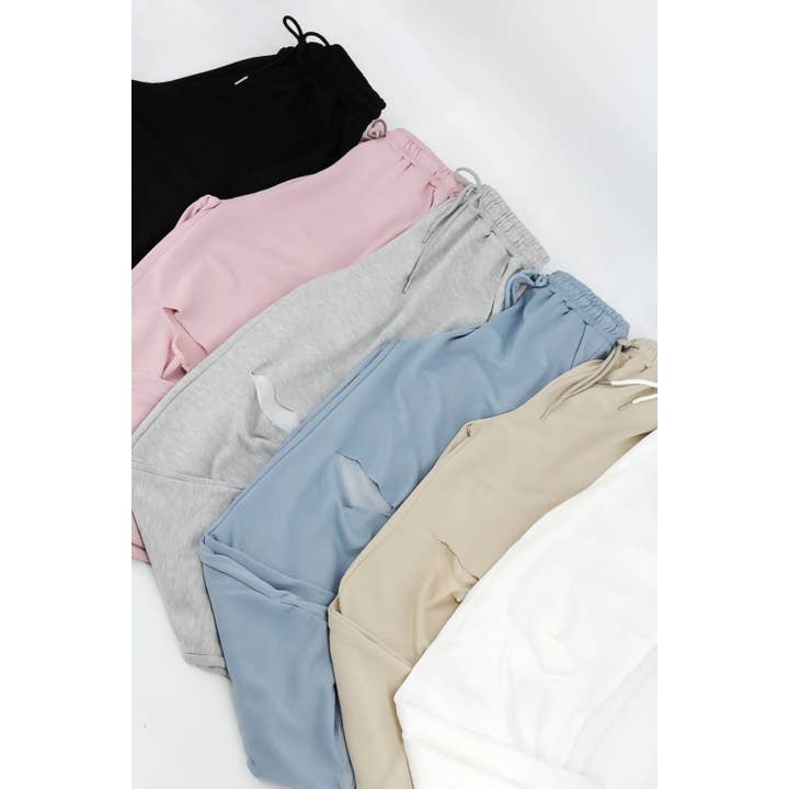 RAW CUT WIDE LEG JOGGER SWEATPANTS WITH KNEE RIP for wholesale by Sweet Generis