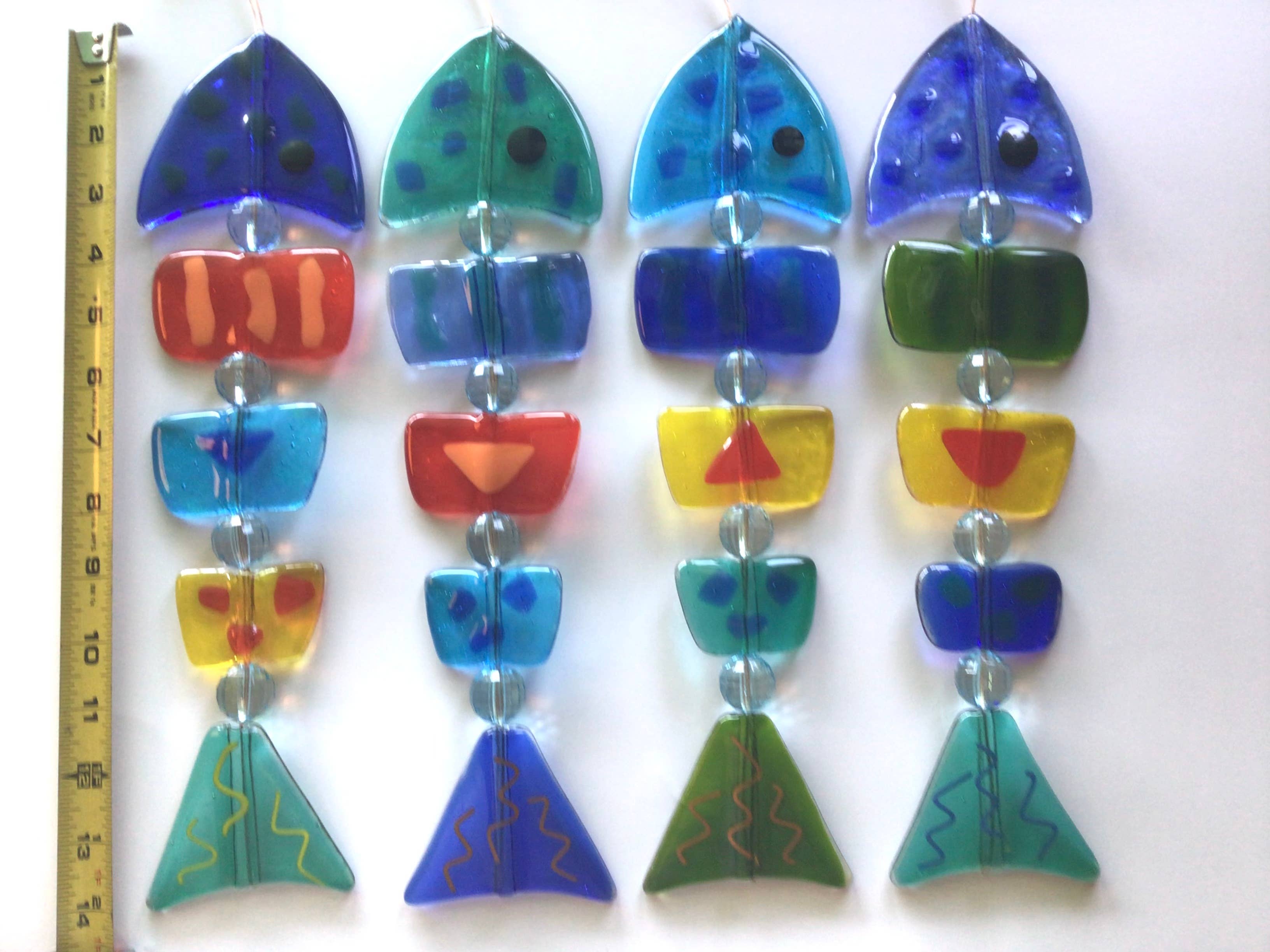 Diverse kleuren Damevis glazen vis mobiel, zonnevanger voor groothandel op Faire5