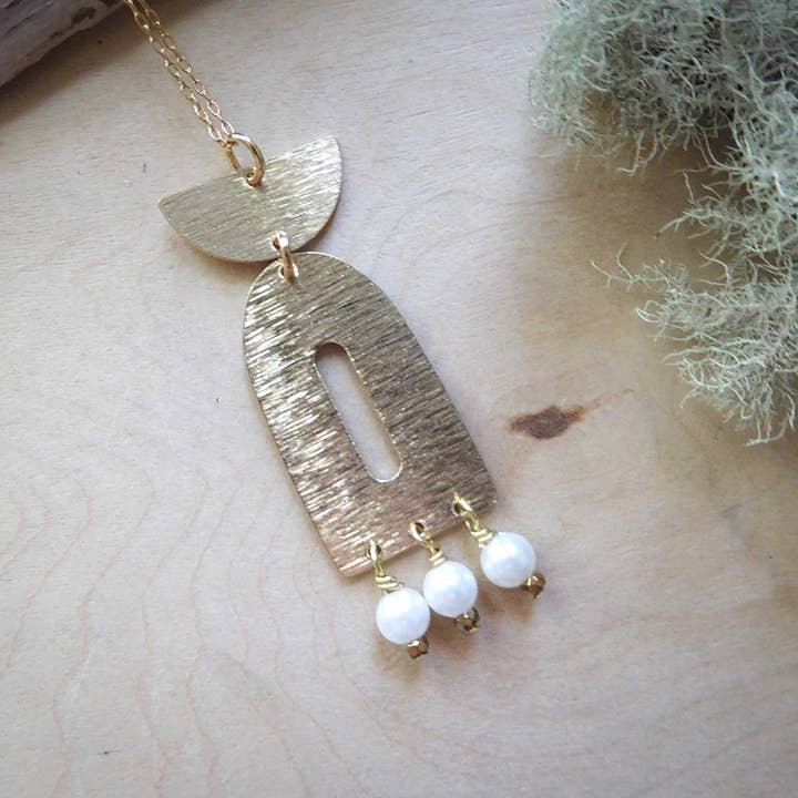 Textured brass d shaped and half moon charm pearl necklace for wholesale by Enchantments by Kathy Welsh