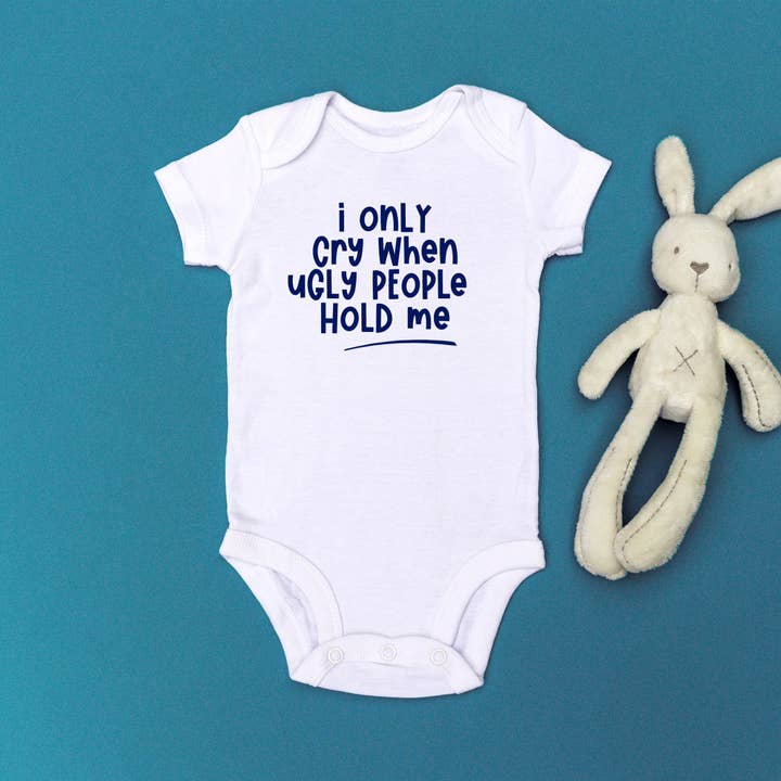 I Only Cry When Ugly People Hold Me' Babygrow for wholesale by Fighty Pants.