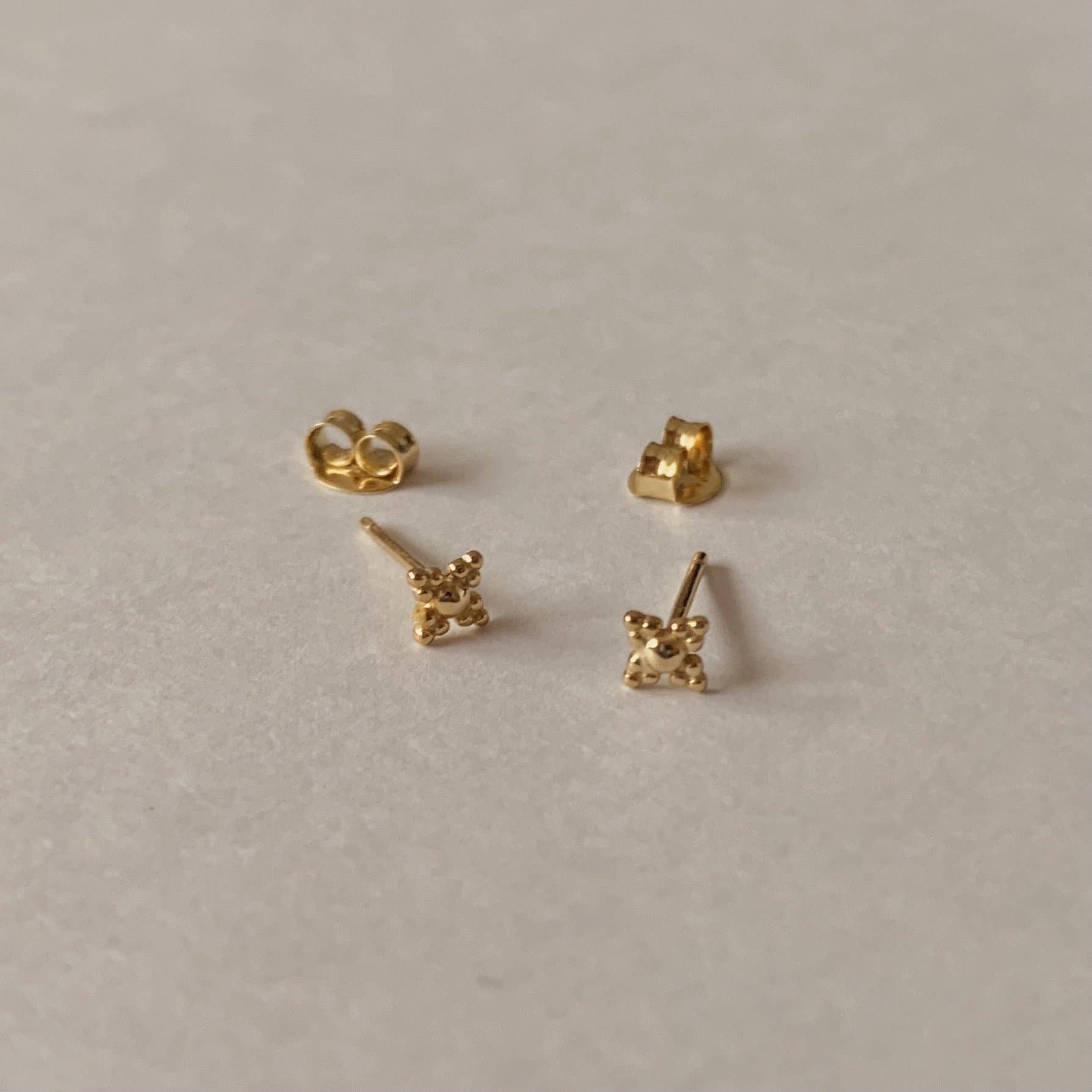 Gold Aura Studs for wholesale on Faire