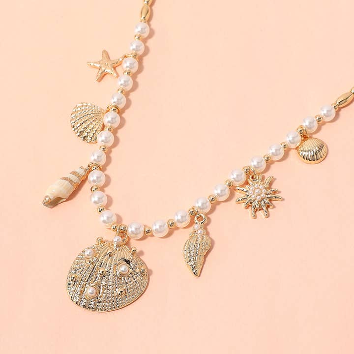 Sensibling Corp. - Wholesale Pendant/Charm Necklace - Sea Shell Puka Shell Starfish Charm Station Pearl Necklace