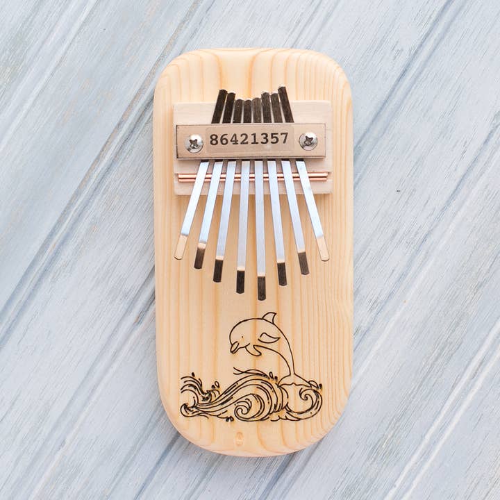 Dolphin Engraved Thumb Piano for wholesale by Mountain Melodies LLC
