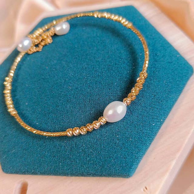 Hemelse Sereniteit – Stalen Armband met Gouden Ovale Kralen voor wholesale door Pompon La Tulipe