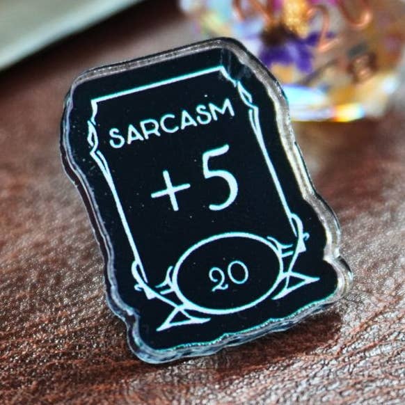 Sarcasm +5 Stat Acrylic Pin for wholesale by Minva Tabletop Design Co