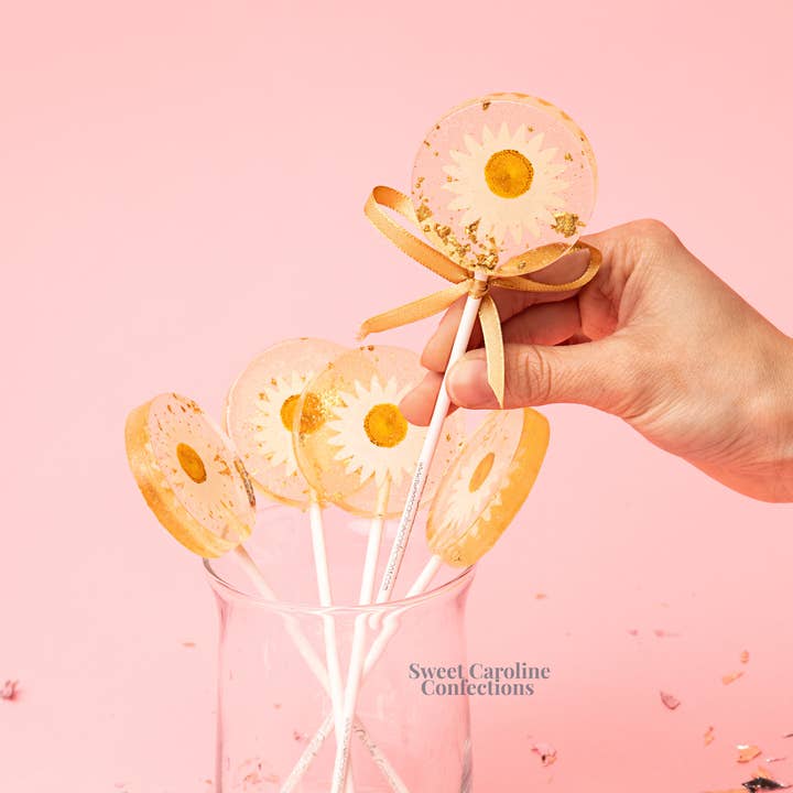 Daisy and Gold Lollipops, Mandarin Orange, 10/Case - VEGAN for wholesale by Sweet Caroline Confections