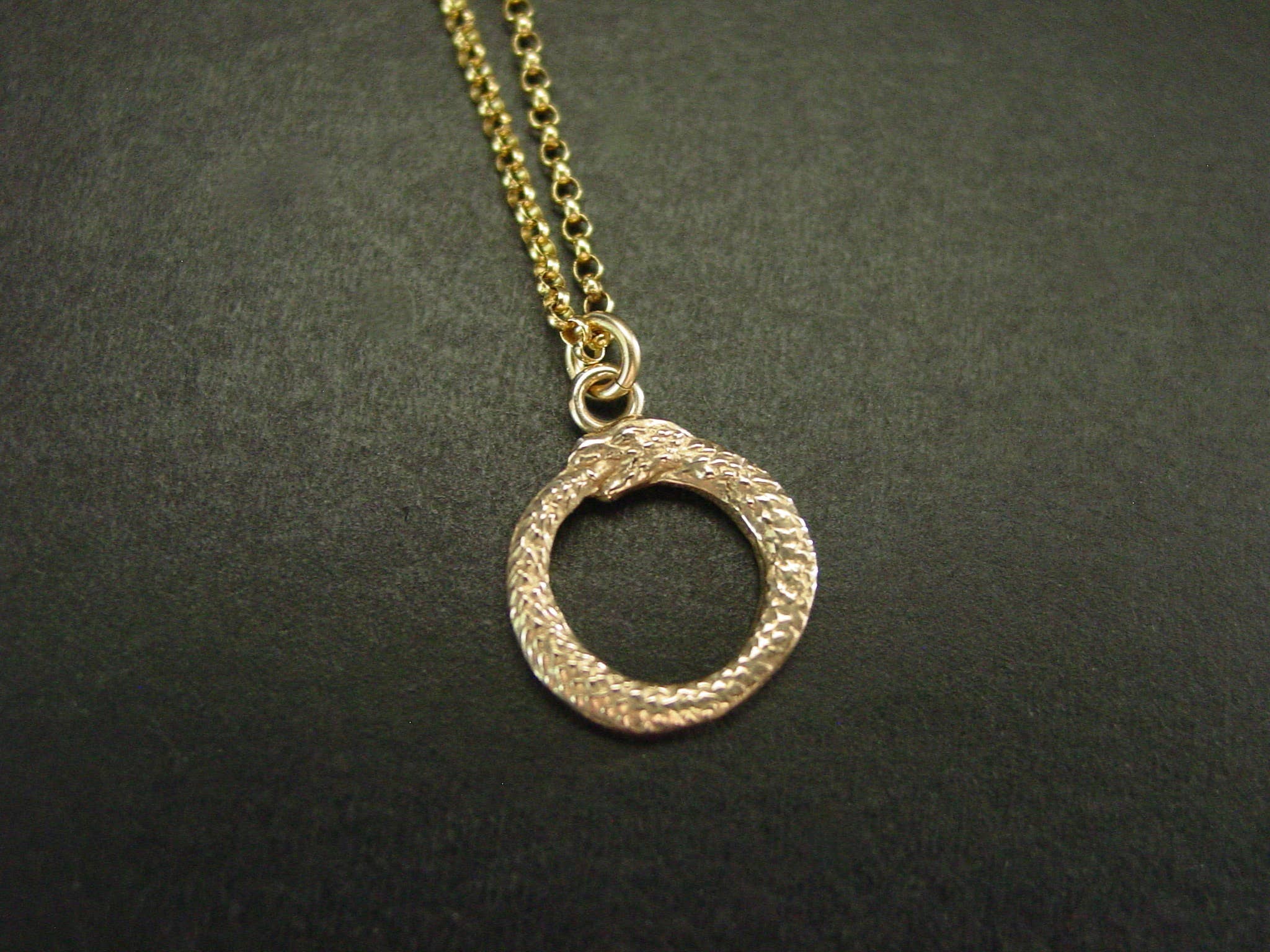 Vis a Vis Jewelry - Wholesale Pendant/Charm Necklace - Ouroboros Necklace - Tiny Hand Sculpted Pendant