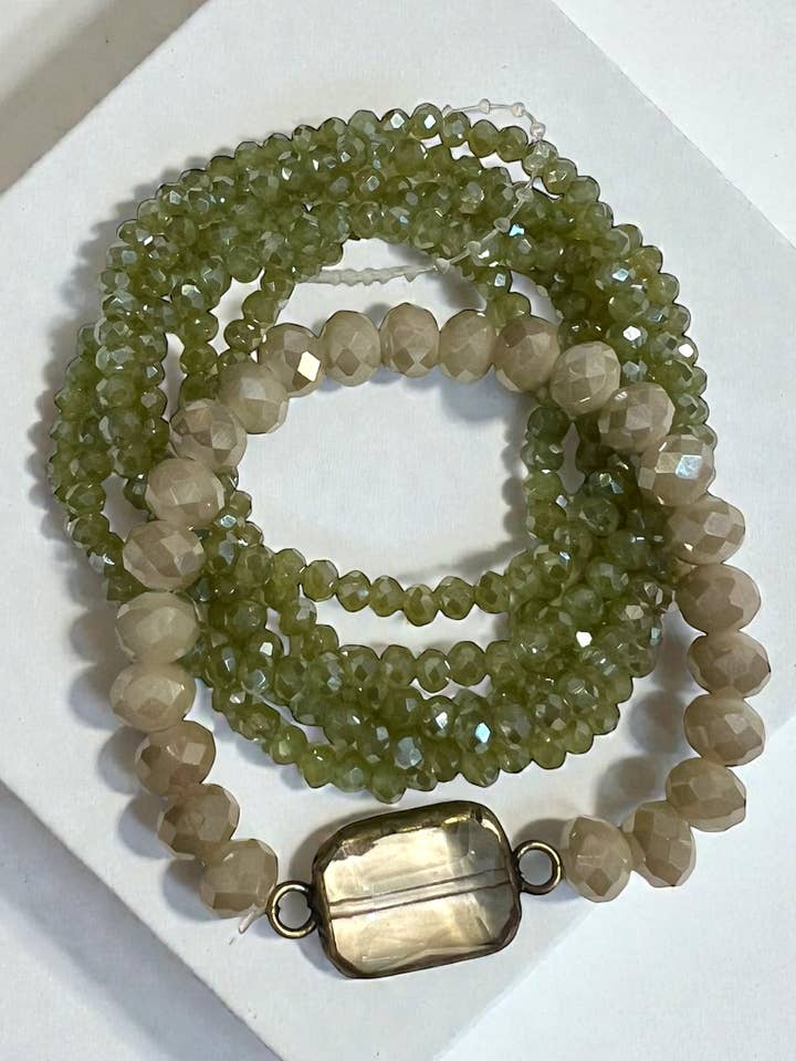 Pulseira Ava marfim com 6 filas de azeitona, elástica, 19 cm por atacado de Ava Capri