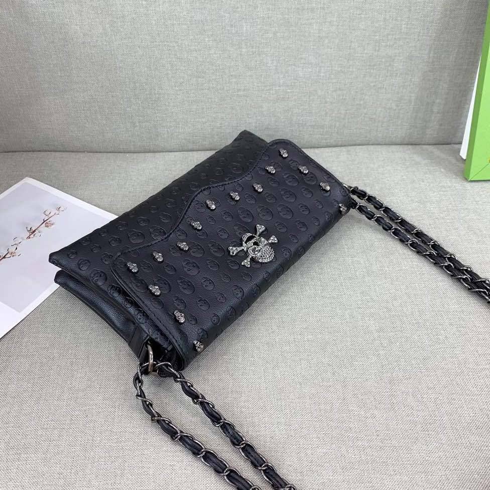 Black Embossed Riveted Skulls Shoulder Bag for wholesale on Faire3